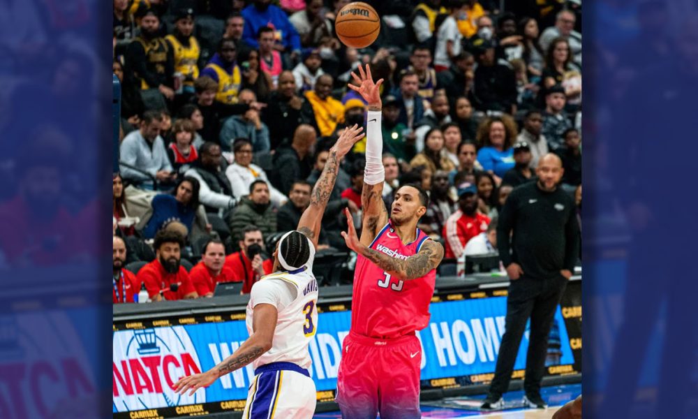 **FILE** Washington Wizards forward Kyle Kuzma (right) shoots over Los Angeles forward Anthony Davis. (Abdullah J. Konte/The Washington Informer)