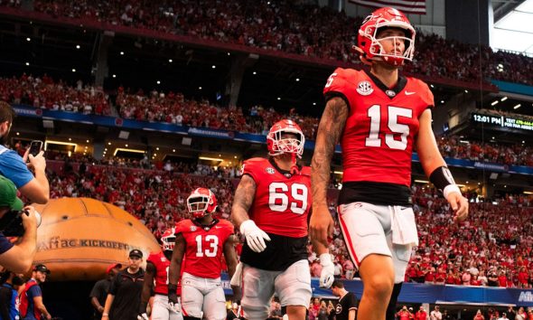Quarterback Carson Beck leads the captains to the field before the start of the 2024 Aflac Kickoff Game between the Clemson Tigers and Georgia Bulldogs on Saturday, August 31, 2024 at Mercedes-Benz Stadium in Atlanta, Georgia. (Photo: Itoro N. Umontuen/The Atlanta Voice)