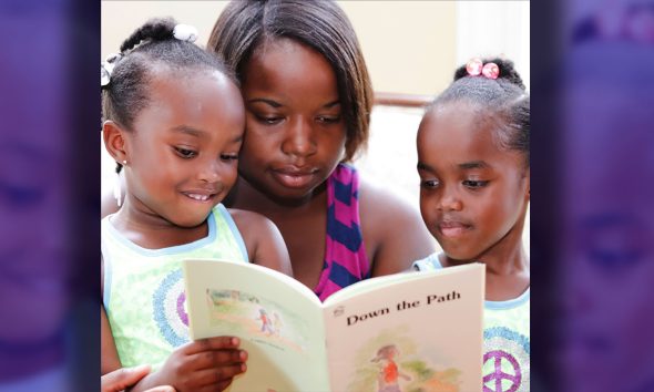 A Mother Reading with Children