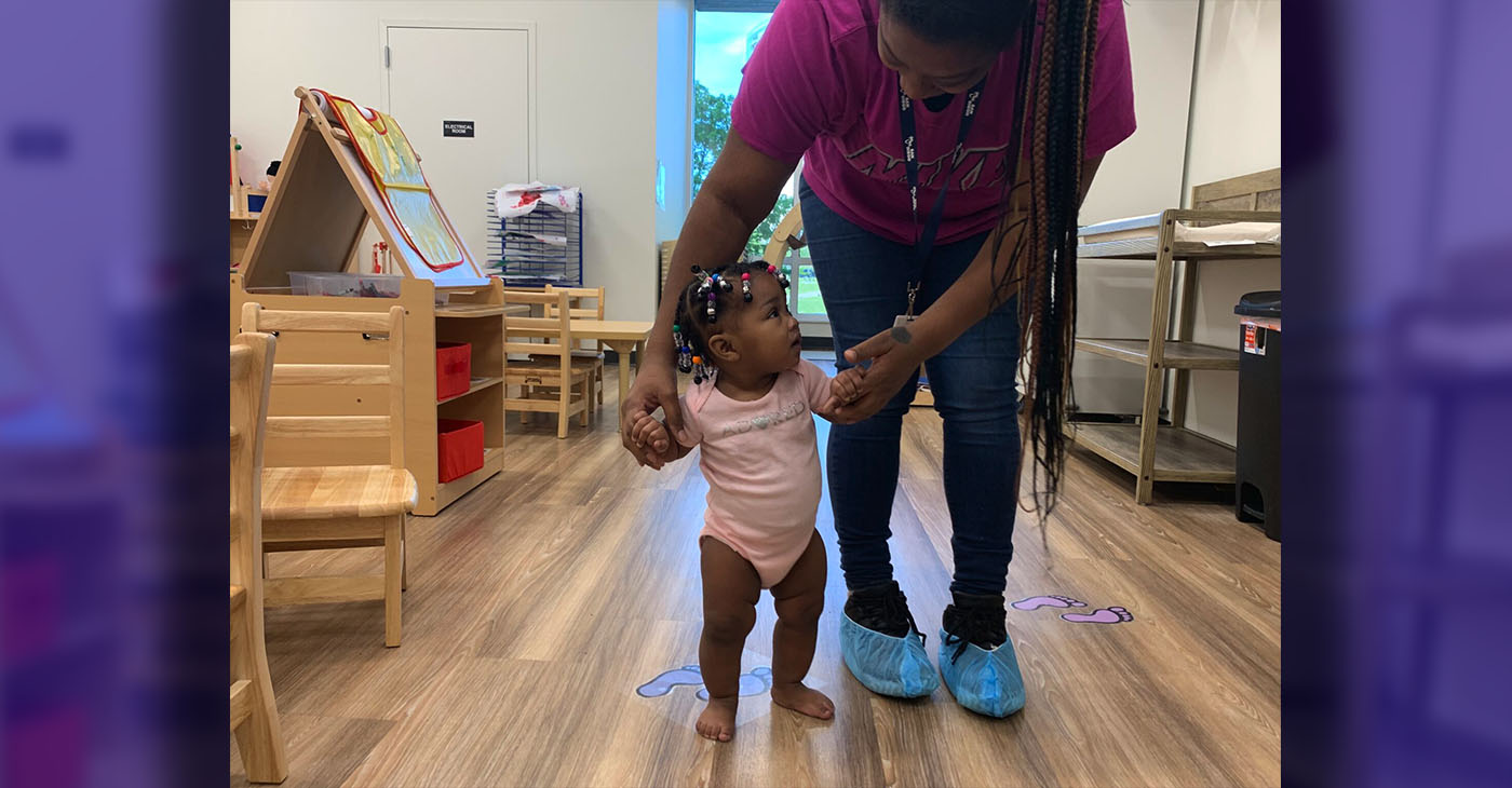 Caregiver Assisting Infant