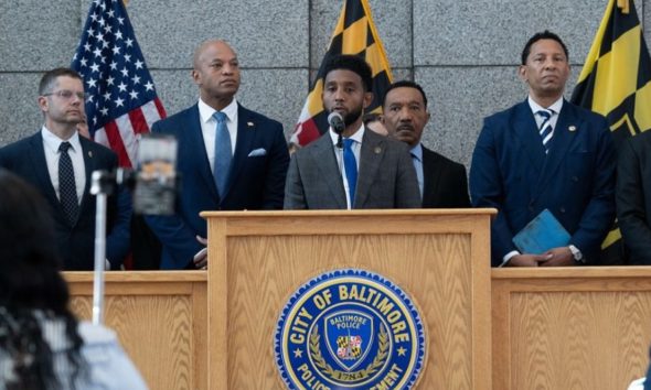 More than 35 people are now indicted on charges related to drug trafficking and illegal guns in the Southwest Baltimore area.  Shown here, Toni Crosby (far left), special agent in charge for the Baltimore Field Division, Jarod Forget, special agent in charge for the DEA’s Washington Division, Maryland Governor Wes Moore, Mayor Brandon M. Scott, Congressman Kweisi Mfume, State’s Attorney Ivan J. Bates and U.S. Attorney Erek L. Barron. Photos courtesy of the Baltimore City Office of the Mayor / J. J. McQueen.