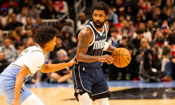 Dallas Mavericks Kyrie Irving works against Kobe Bufkin of the Atlanta Hawks during an NBA game on Monday, November 25, 2024 at State Farm Arena in Atlanta, Georgia. (Photo: Itoro N. Umontuen/The Atlanta Voice)