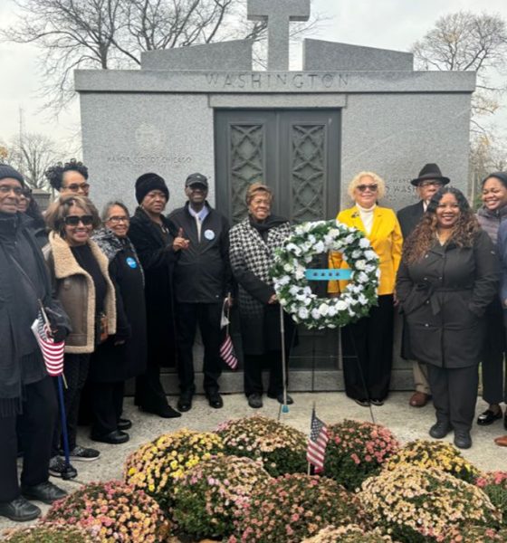 Members of the Mayor Harold Washington Legacy Committee present a wreath at the former mayor’s gravesite at Oak Woods Cemetery (Photo Credit: Tacuma R. Roeback).