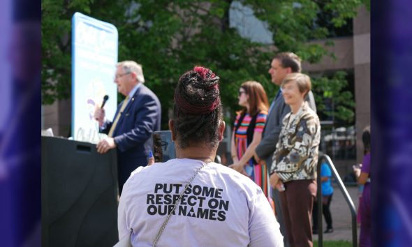 A participant at the Child Care for North Carolina: United for Change rally in Raleigh listens to a lawmaker who’s a member of the state’s early childhood caucus.