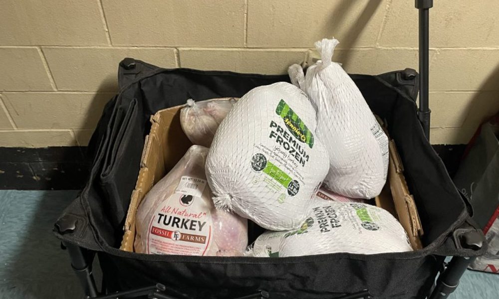 This year’s giveaway provided 87 turkeys and Boxes of Love floor-by-floor of the 14th floor housing complex. Credit: Sherica Daley photo