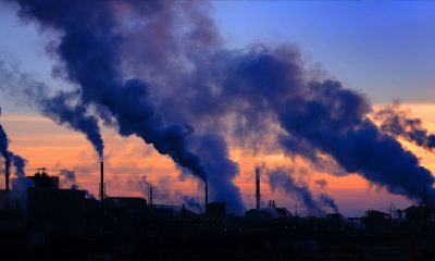 Pollution smoke from a factor plan in the air with sky bad for the environment