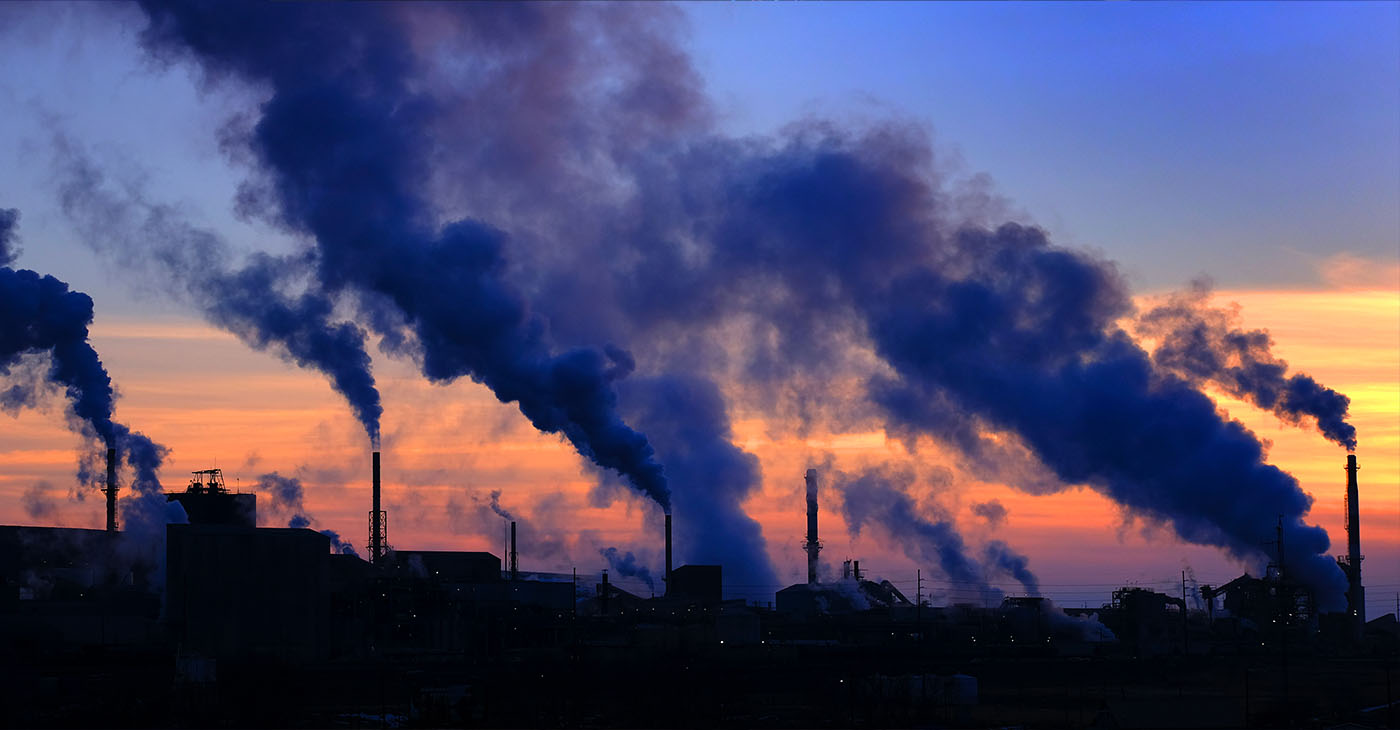 Pollution smoke from a factor plan in the air with sky bad for the environment