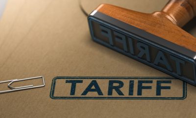 rubber stamp with the word tariff stamped on paper background (Photo Credit By Olivier Le Moal)
