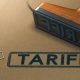 rubber stamp with the word tariff stamped on paper background (Photo Credit By Olivier Le Moal)