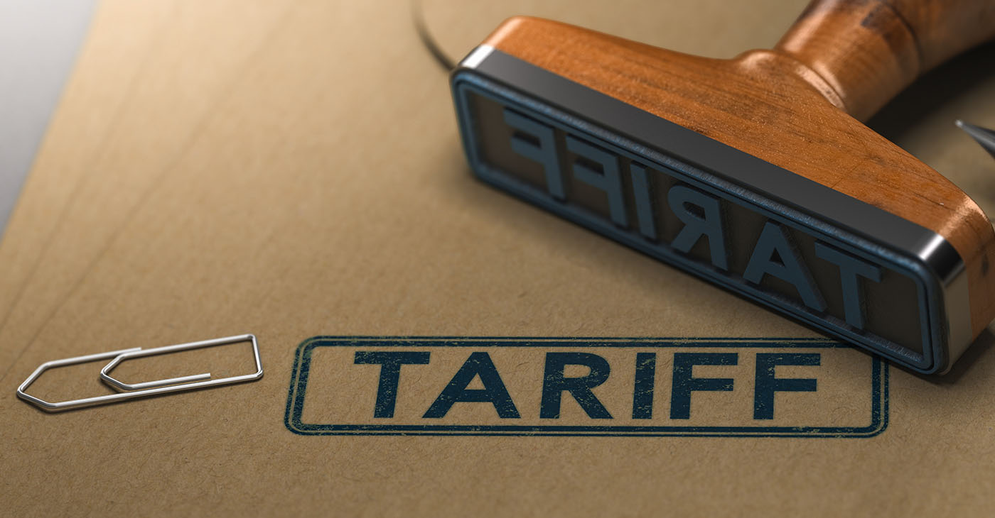 rubber stamp with the word tariff stamped on paper background (Photo Credit By Olivier Le Moal)