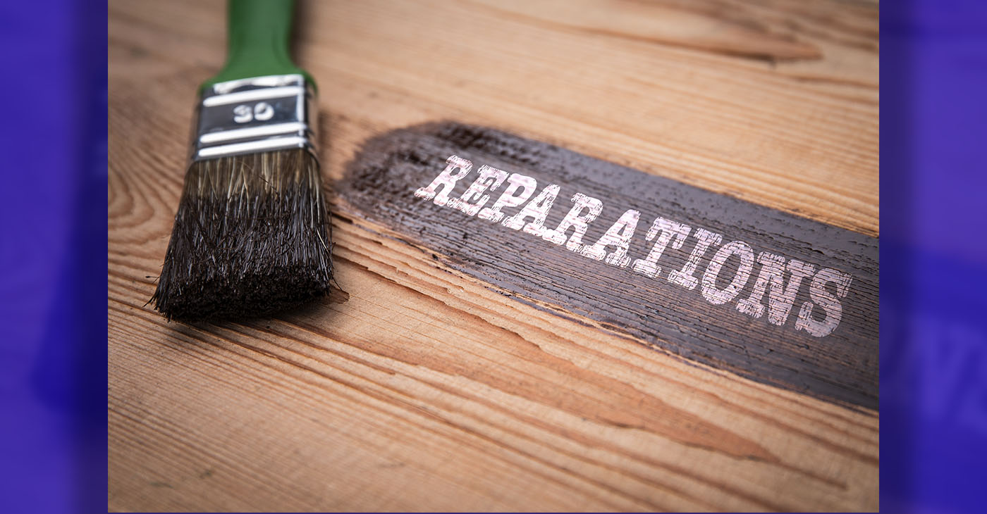 Reparations Concept. Green brush and painted wooden board with text.