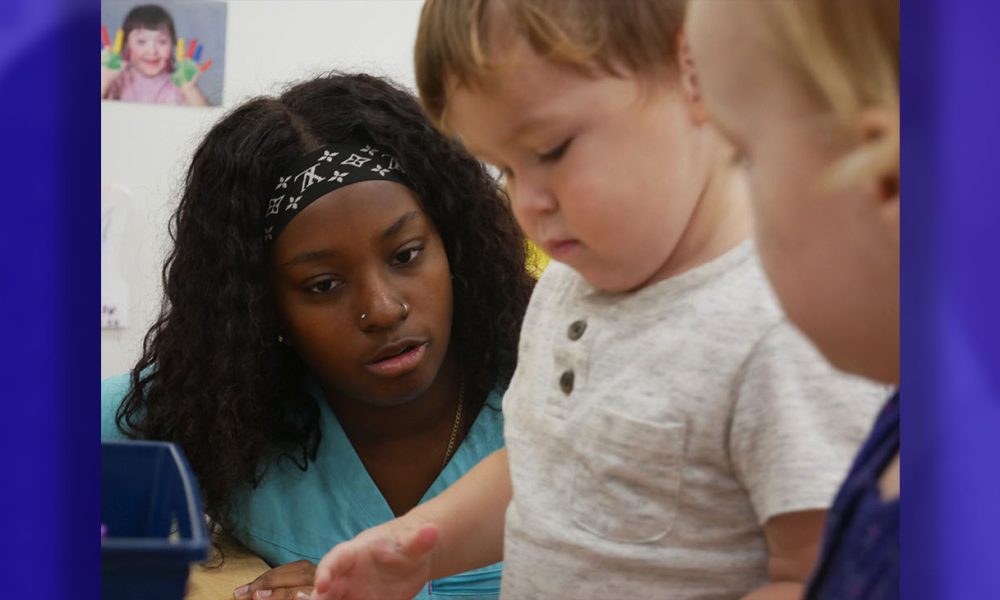 Precious, a teacher at Kate's Korner in Durham, North Carolina, oversees center time in a toddler classroom. Photo by: Liz Bell, EdNC