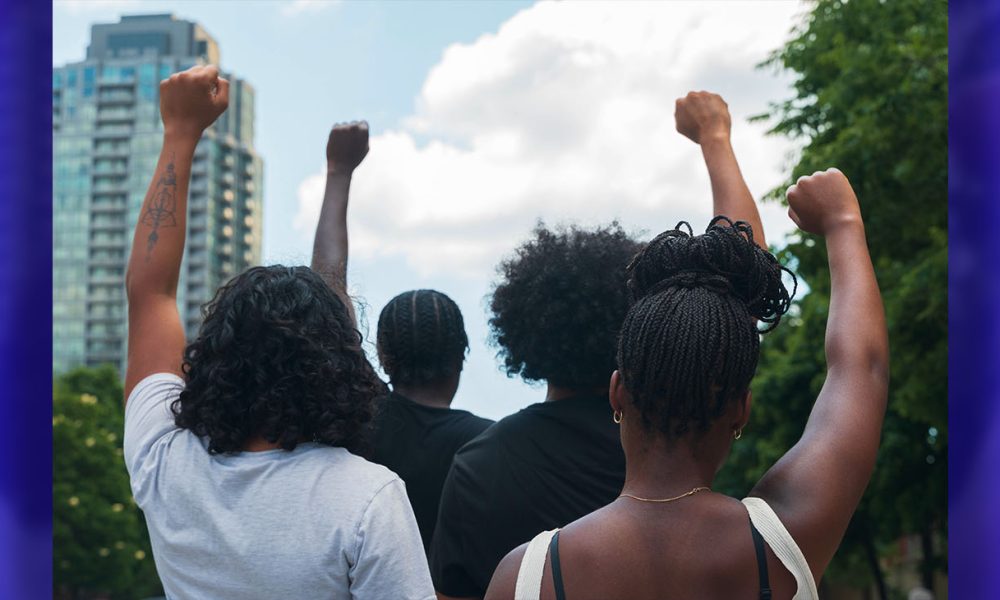 A group of African American people protest racial injustice in light of protest.