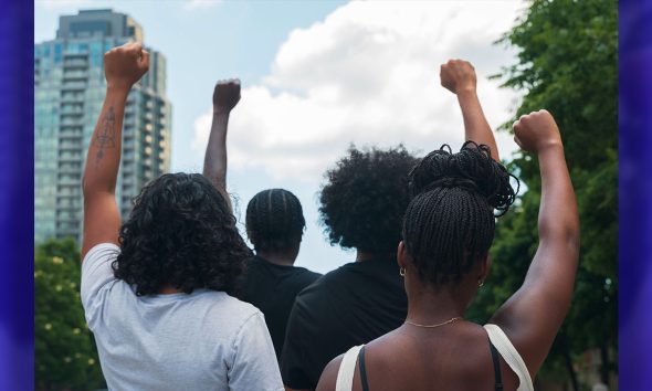 A group of African American people protest racial injustice in light of protest.