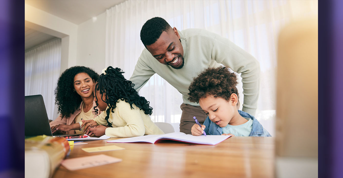 Writing, drawing and parents with children for homework, school activity and learning with notebooks (Photo Credit by Jacob Wackerhausen)