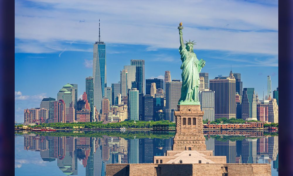 Statue of Liberty and New York City Skyline with Manhattan Financial District, Battery Park, Water of New York Harbor, World Trade Center, Empire State Building