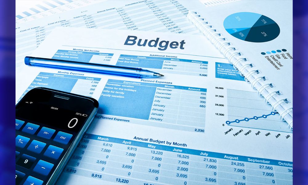 Budget planning with calculator and pie charts.