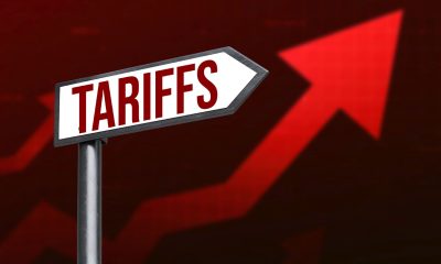 Tariffs increasing concept with Red graph in the backdrop of a signboard. (Photo by Muhammad Farhad)