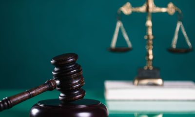 Law and Justice concept. Mallet of the judge, books, scales of justice (Photo by Michał Chodyra)