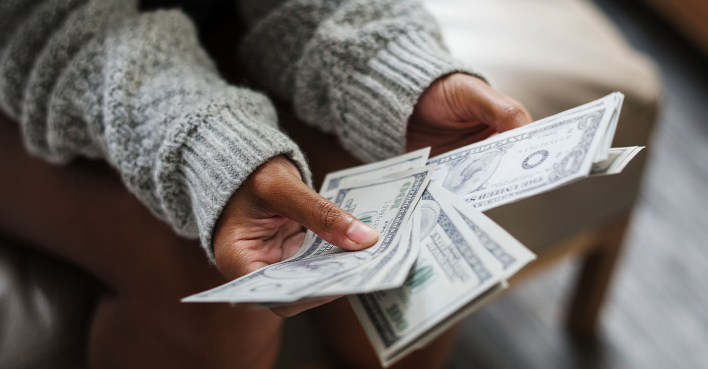 Closeup of woman counting money