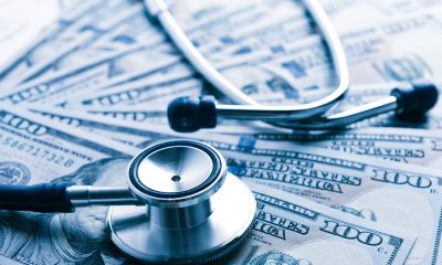 The cost of healthcare. Blue toned (Photo by Valeriya)