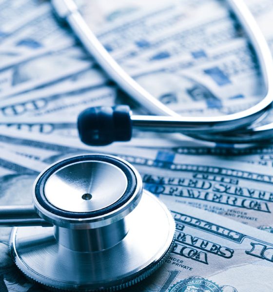 The cost of healthcare. Blue toned (Photo by Valeriya)