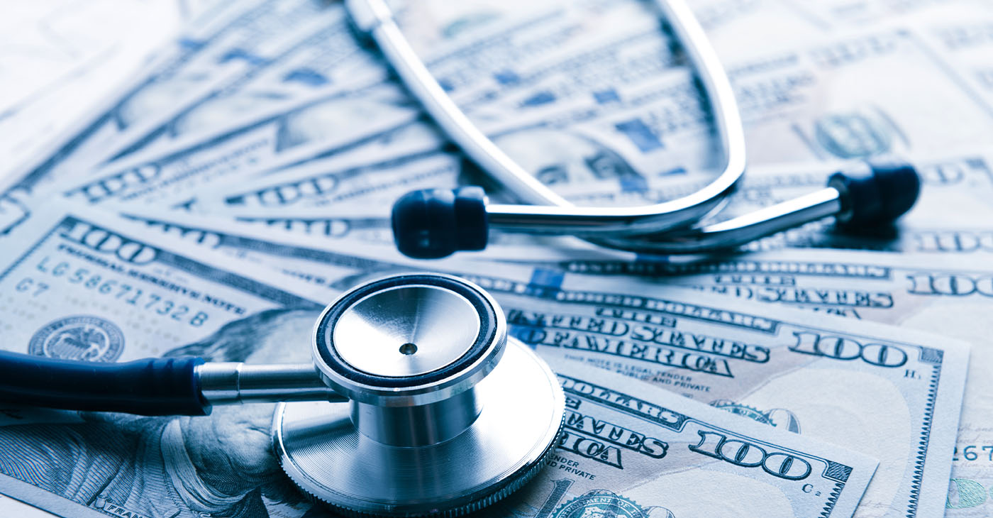 The cost of healthcare. Blue toned (Photo by Valeriya)