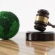 Environment Law. Green Globe World and gavel hammer. Environmental protection and eco-friendly legislation law. Save Earth. ESG concept. (Photo by Alexander Sikov)