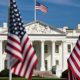 This compelling photograph captures the essence of American democracy with a captivating view of the White House in the background, framed by a row of American flags in the foreground. The flags, symbolizing the nation's unity and resilience, stand proudly in front of one of the most iconic landmarks in the United States. (Photo by Castle City Creative)