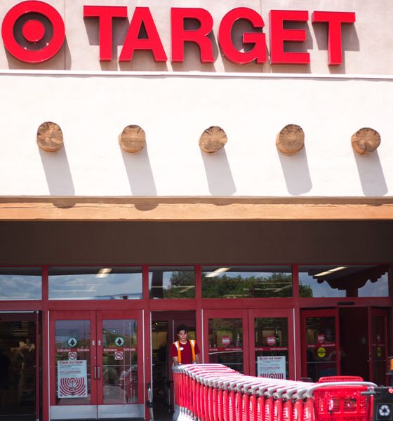 Santa Fe, NM: A Target employee pulls red shopping carts into the Santa Fe NM store. Santa Fe’s Target is constructed in the Southwest Pueblo architectural style. (Photo by Jann Huizenga)