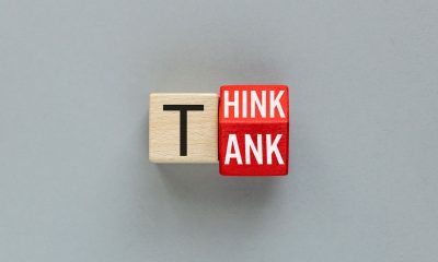 Think Tank symbol. wooden dice form the expression "think tank". Words conceptual, grey background, copy space (Photo by Andrzej Rostek)