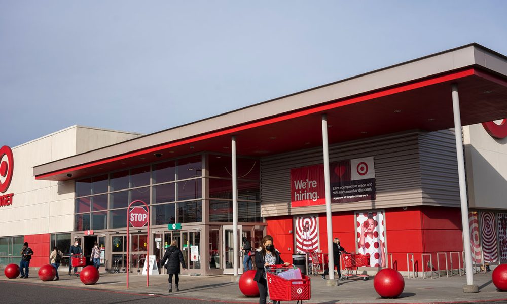 Portland, OR, USA - Jan 14, 2022: Masked shoppers outside a Target Store in northeast Portland, Oregon, during the Omicron variant surge.