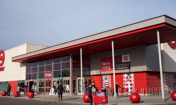 Portland, OR, USA - Jan 14, 2022: Masked shoppers outside a Target Store in northeast Portland, Oregon, during the Omicron variant surge.
