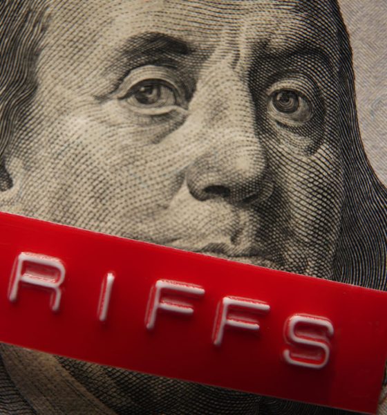 Red Tariffs label on a hundred dollar bill