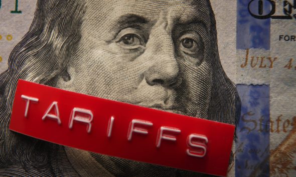 Red Tariffs label on a hundred dollar bill