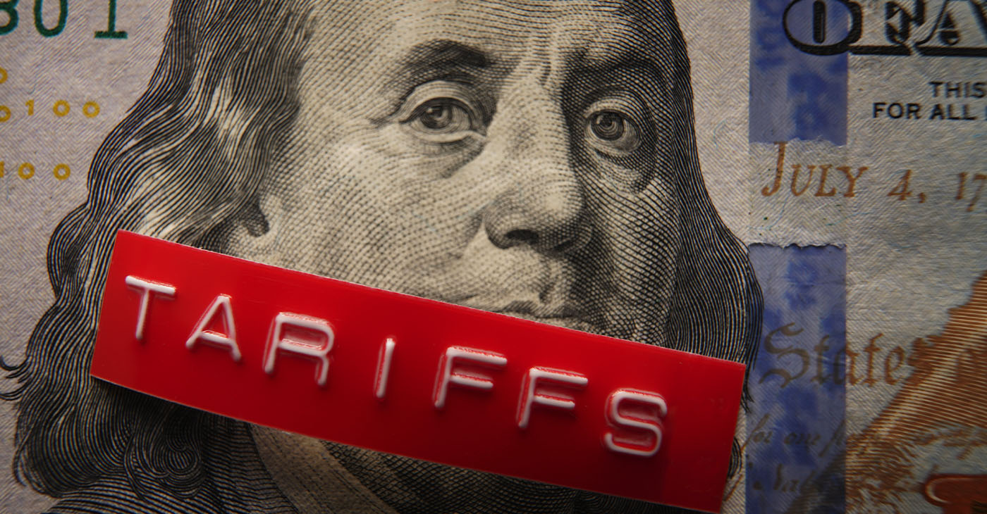 Red Tariffs label on a hundred dollar bill