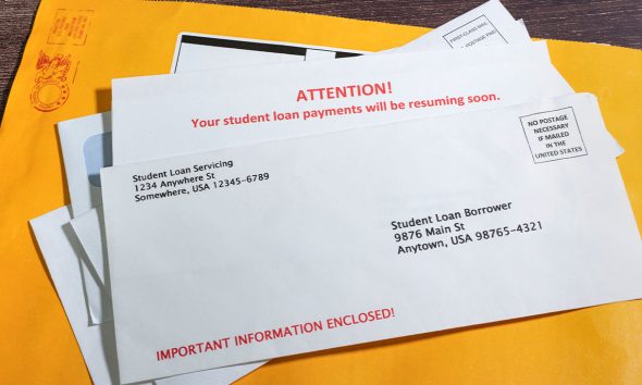A student Loan Payments Resuming Notice in Envelope on top of other mail. (Photo by Richard Stephen)