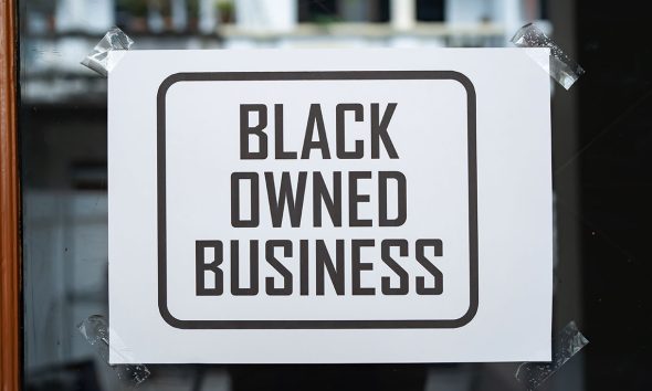 Black owned business sign was attached on the window