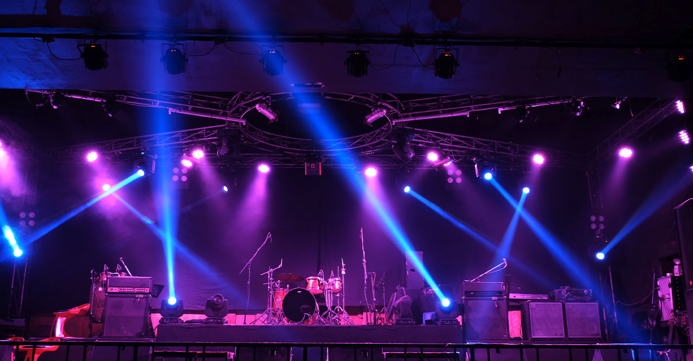 Stage lighting beams spotlight and smoke of events show or concerts