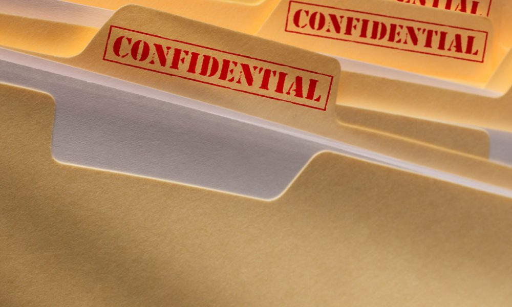A stack of confidential files.