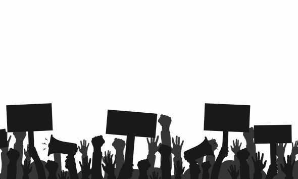 Crowd of protesters people. Silhouettes of people with banners and megaphones. Concept of revolution or protest. Vector (Photo by Yevhenii Dubinko)