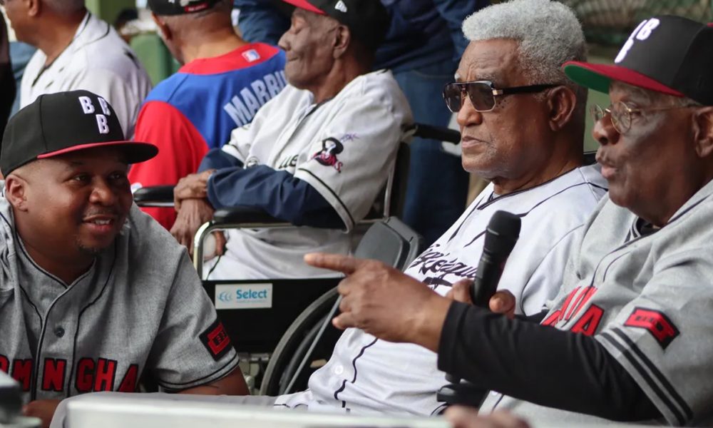 Ron Wood (left) talks to Negro League legend Al Holt (right).