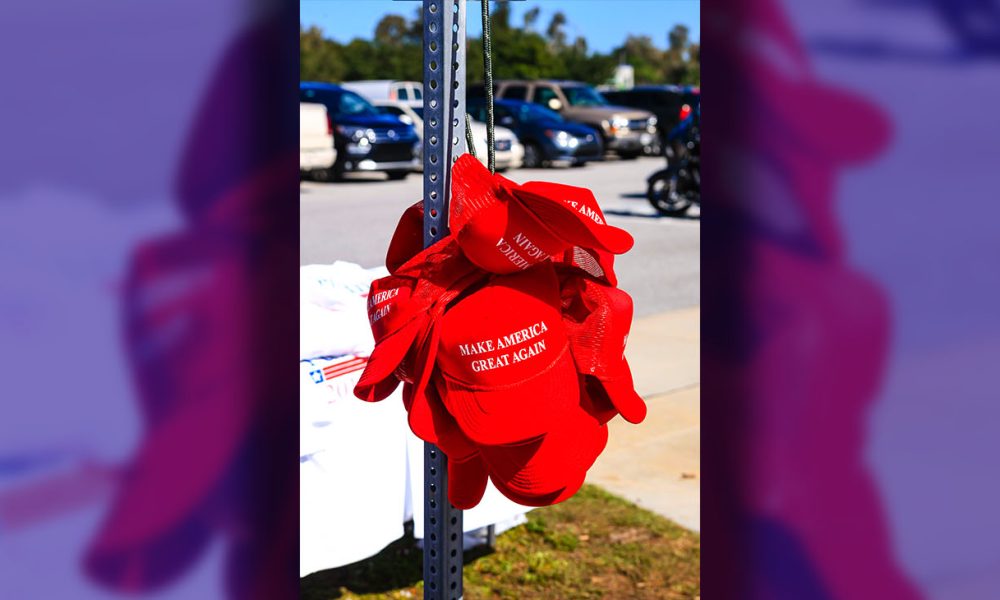 Sarasota, FL, USA - November 28, 2015: Donald Trump for President "Make America Great Again" red baseball hats on sale at his Presidential candidate tour stop in Sarasota FL