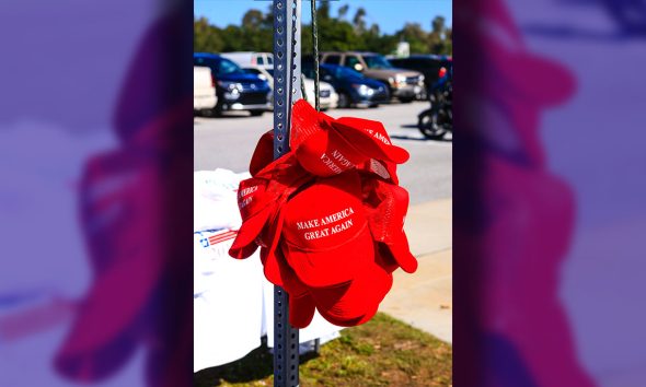 Sarasota, FL, USA - November 28, 2015: Donald Trump for President "Make America Great Again" red baseball hats on sale at his Presidential candidate tour stop in Sarasota FL