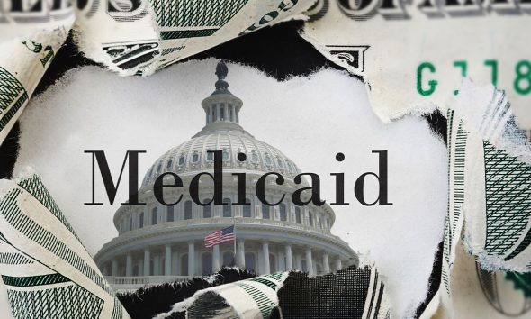 Torn dollar bill with medicaid text and US Capitol