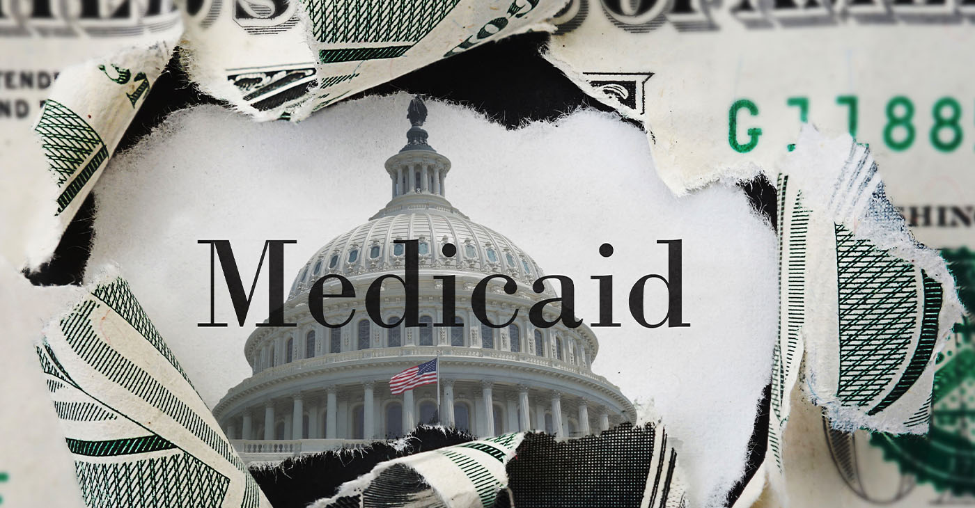 Torn dollar bill with medicaid text and US Capitol