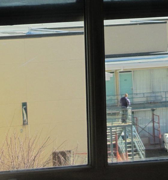 View of Lorraine Hotel, from second floor bathroom window in the boarding house from where James Earl Ray was alleged to have fired the fatal shot at Martin Luther King, Jr. Boarding house view of Lorraine Motel balcony. Photo: Mr. Littlehand / Wikimedia Commons.