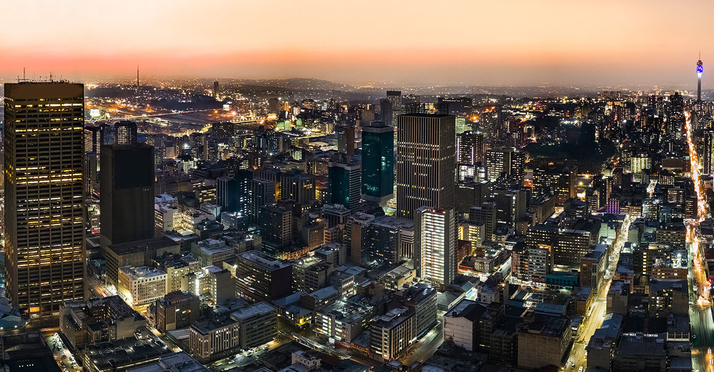 Johannesburg city centre metropolitan cityscape at sunset with its urban skyline.