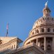 Texas state capitol building dome with a blue sky in the background