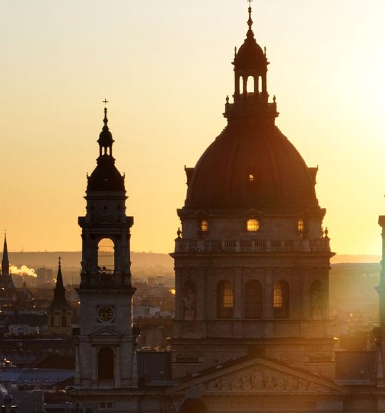 Aerial view of the famous St. Stephen's Basilica in Budapest at sunrise St. Stephen's Basilica is a Roman Catholic basilica in Budapest, Hungary. It is named in honour of Stephen, the first King of Hungary, whose right hand is housed in the reliquary. Since the renaming of the primatial see, it has been the co-cathedral of the Roman Catholic Archdiocese of Esztergom-Budapest. Today, it is the third largest church building in present-day Hungary. It is the largest church in Budapest and a World Heritage Site. (Photo by Guven Ozdemir)